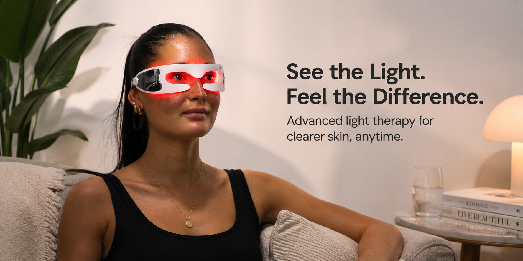 Women sitting on a couch with a red light eye mask on.